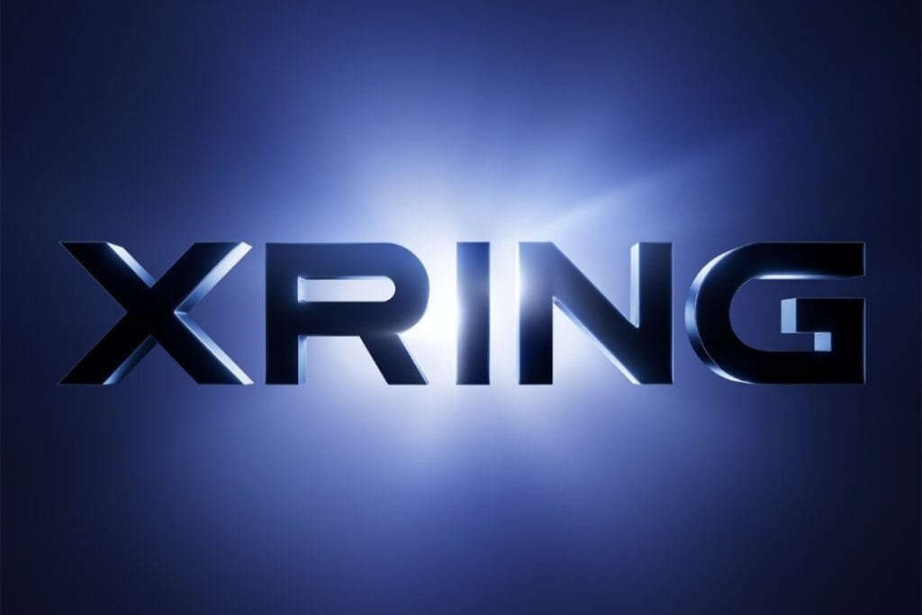 Xiaomi Teases New Xring Chip, Rumored Xring O3 Packs 4.05 GHz Prime Core XRING logo in bold metallic 3D lettering set against a glowing deep blue gradient background with a bright light flare behind the text.
