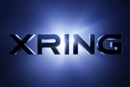 Xiaomi Teases New Xring Chip, Rumored Xring O3 Packs 4.05 GHz Prime Core XRING logo in bold metallic 3D lettering set against a glowing deep blue gradient background with a bright light flare behind the text.