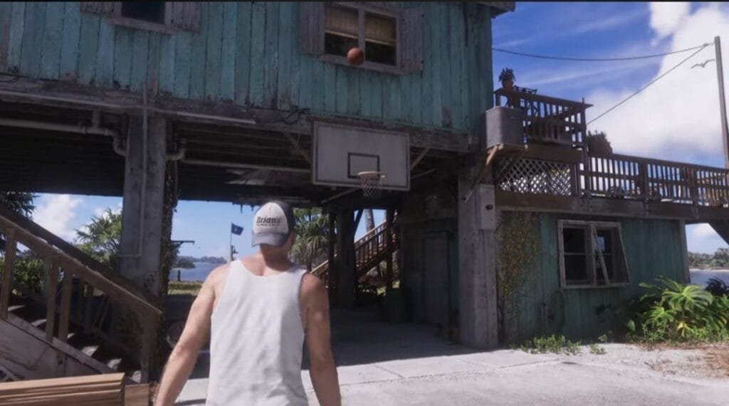 GTA 6 Extended Look Released: Everything Shown in the 27-Minute Video 9 GTA 6 Extended Look gameplay showing Jason playing basketball outside a weathered stilt house in Leonida, basketball hoop mounted under the building, coastal waterfront setting.