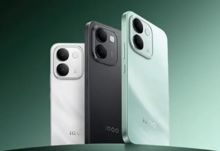 iQOO Z11S Launched With MediaTek Dimensity 7500 and Massive 10,000mAh Battery iQOO Z11S three color variants shown from rear view: Wanli Floating Light white, Ink Rock Black, and Snow Island Green, featuring vertical dual-camera module with square frame and centered iQOO logo on gradient green background.