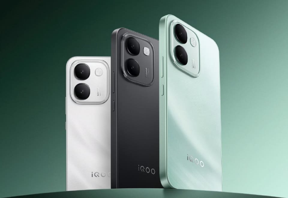 iQOO Z11S Launched With MediaTek Dimensity 7500 and Massive 10,000mAh Battery iQOO Z11S three color variants shown from rear view: Wanli Floating Light white, Ink Rock Black, and Snow Island Green, featuring vertical dual-camera module with square frame and centered iQOO logo on gradient green background.
