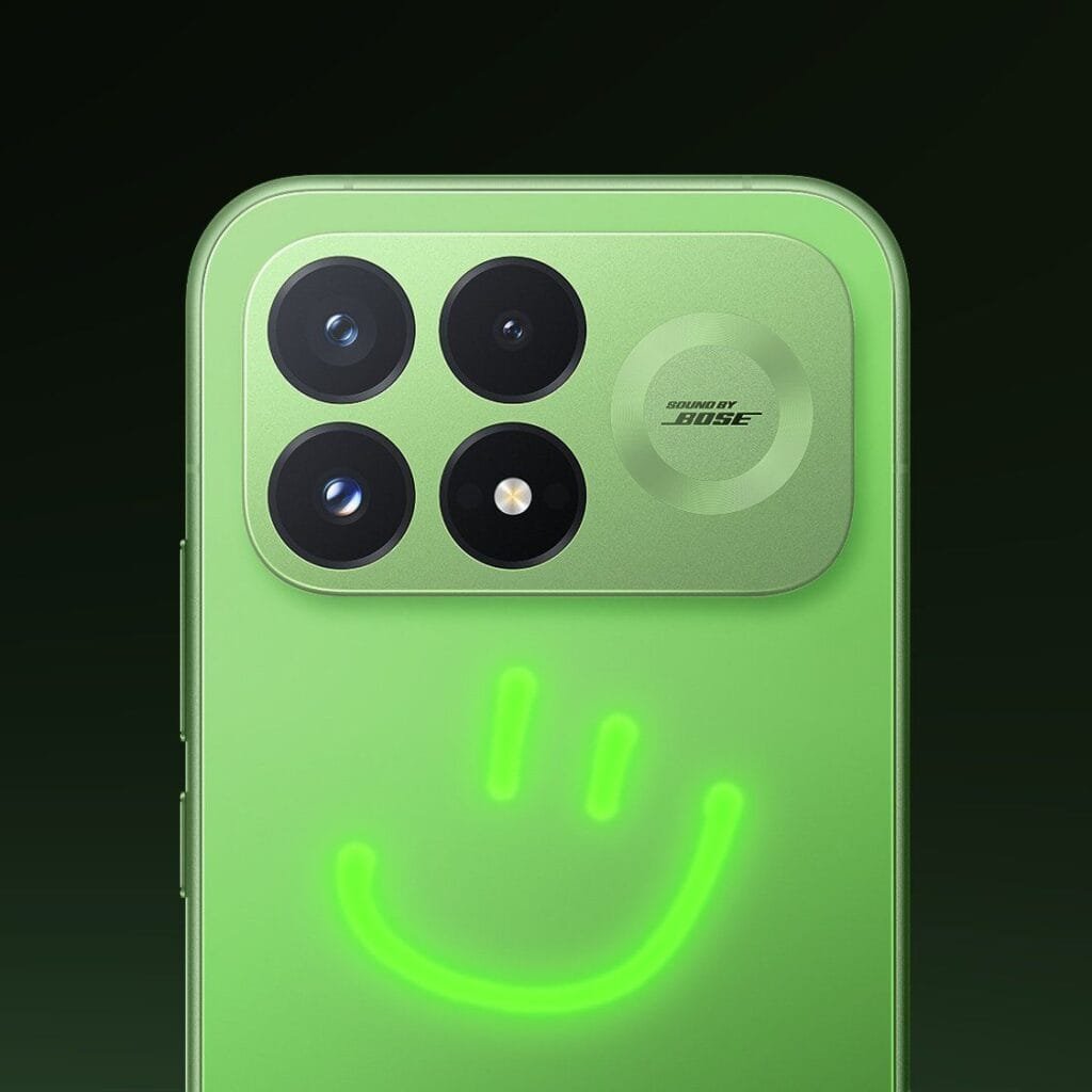 Redmi K100 Pro Glowing Firefly Variant Unveiled 4 A direct rear shot of the upper portion of the Redmi K100 Pro, showcasing its glow-in-the-dark back panel customized with a glowing green smiley face drawn underneath the camera module.