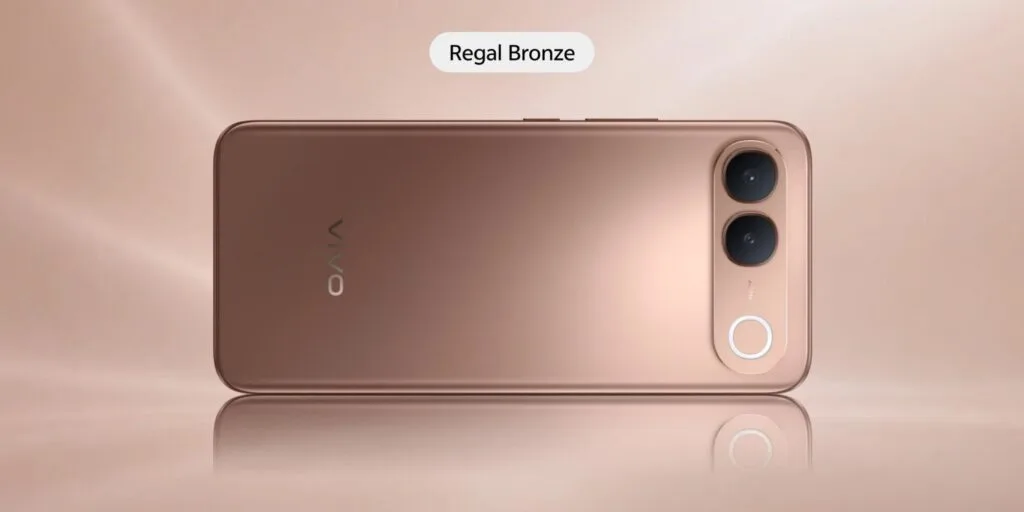Vivo S2 smartphone viewed from the rear in the Regal Bronze finish, featuring a smooth metallic gold-bronze rear panel, vertical dual-camera module, circular accent ring, and vivo logo against a warm neutral background.