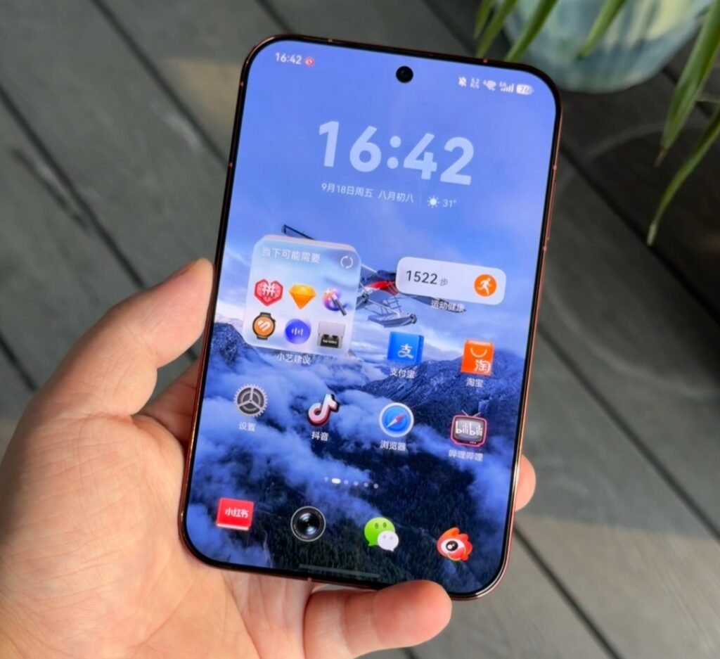 Huawei Pura X View Reportedly Surpasses 280,000 Units in Early Sales Huawei Pura X View smartphone held in hand. Front view showing large wide screen display, slim rounded edges, and premium finish. Home screen with HarmonyOS interface, time and date, and app icons including WeChat, Douyin, and Xiaohongshu. Soft outdoor background.