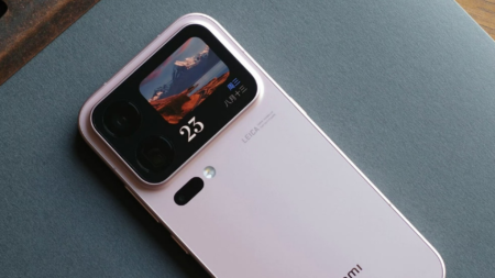 Xiaomi 18 Pro in soft pink finish, rear secondary display showing date and landscape photo, dual camera lenses, Leica branding
