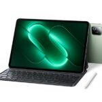 Xiaomi Pad 9 Launched in China with Snapdragon 8s Gen 4 and 9,720mAh Battery 5 Xiaomi Pad 9 tablet shown with attached magnetic keyboard and stylus beside it. Spruce Green back panel visible with square camera module. Screen displays glowing green abstract design. White background. Official product image.