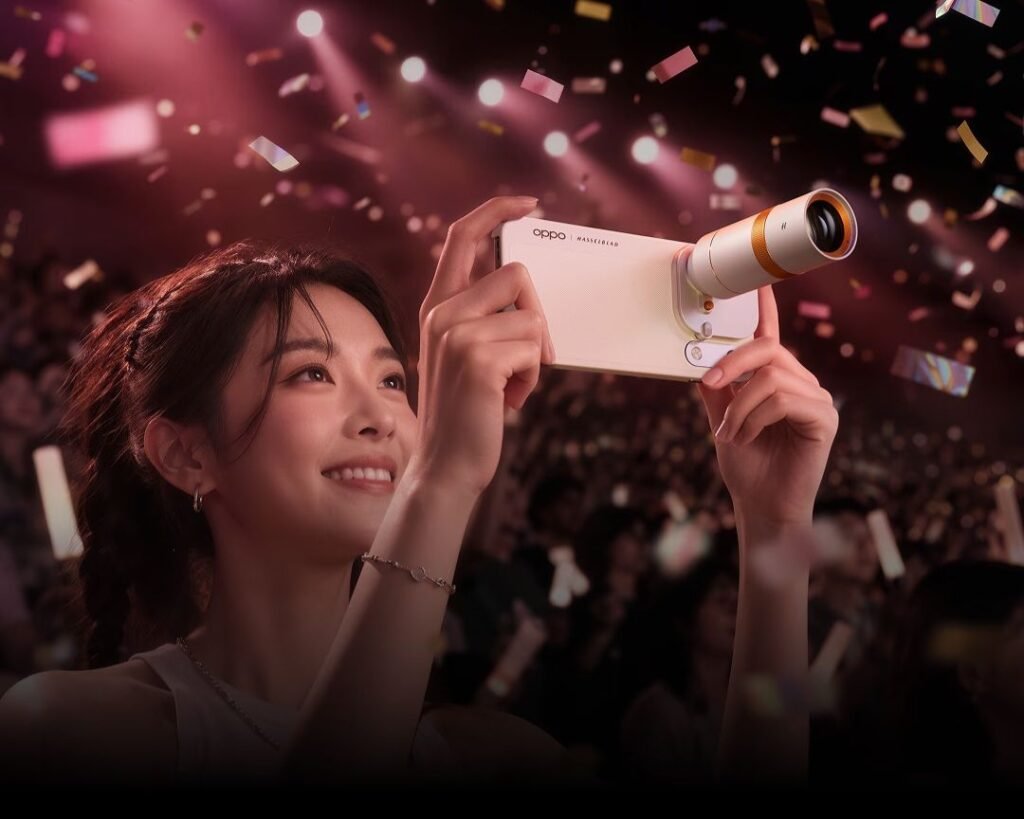 Oppo Find X10 Pro Max Launched in China with Triple 200MP Cameras for Professional-level Filmmaking 1 Oppo Find X10 Pro Max with Hasselblad telephoto extender attached, capturing live event with stage lights and confetti in background