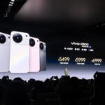Vivo X500 Launched in China with Dimensity 9600M, 1.5K AMOLED Display, and 7,500mAh Battery 1 Vivo X500 launch event showing four color variants on stage screen with pricing 5499 to 6999 CNY, presenter standing below, audience taking photos