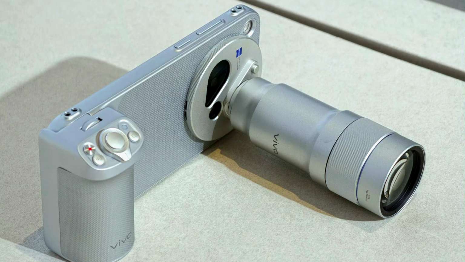 Vivo X500 Pro Max Launched in China with 50MP Sony LYTIA L910 and 200MP Samsung HP0 Periscope Vivo X500 Pro Max with detachable Zeiss telephoto lens accessory and camera grip, sleek silver metallic finish