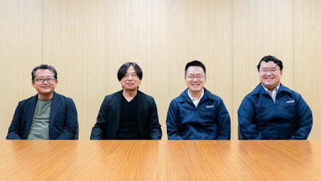 Nintendo Reveals How Fire Emblem: Fortune’s Weave Brings Four Stories Together Four Fire Emblem Fortune's Weave developers seated side by side at a wooden table during an official project discussion. The group includes key production and creative team members from the development partnership.