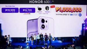 Honor 600s launched in the Philippines 1 HONOR 600S 5G launch event stage with large display showing pricing at ₱19,999 for 8GB plus 256GB and ₱15,799 for 6GB plus 128GB. Pre-order period October 1 to October 9 2026 includes free HONOR Bluetooth Speaker and Choice Watch 2. Group of officials standing on stage in front of phone render. SM Store ₱1,000,000 shopping spree promo displayed.