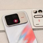 Honor WIN2 rear design with gradient finish silver camera module glowing red WIN indicator light and detachable accessory panel.
