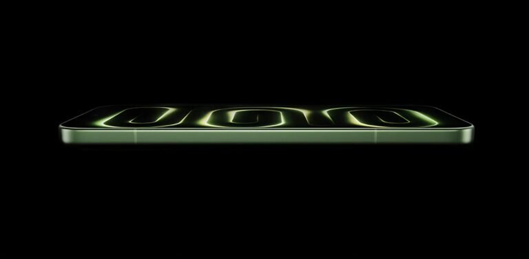 Redmi K100 side profile in green finish with glowing neon green design on screen against black background